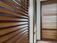 Elegant timber plantation shutters by ASI Security, enhancing privacy, light control, and style in h